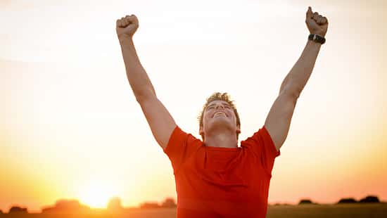 Successful,Man,Raising,Arms,After,Cross,Track,Running,On,Summer