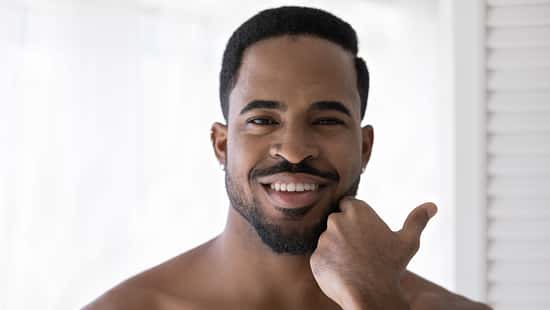 Head,Shot,Portrait,Smiling,Satisfied,African,American,Young,Man,Touching
