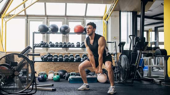 Man training with kettlebell