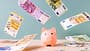 Piggy bank and falling European Union currency