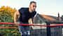 Young,Muscular,Man,Doing,Calisthenics,Outside,Lifting,Himself,Above,The