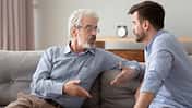 Serious,60s,Elderly,Father,And,Grown,Up,Adult,Son,Sitting