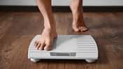 Man,Standing,On,Weight,Scale