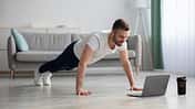 Happy,Middle-aged,Man,In,Sportswear,Doing,Push-ups,,Using,Laptop,,Having