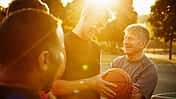 Laughing group of basketball players on court