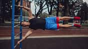 Strong,Athletic,Man,Doing,Flagpole,In,Outdoor,Gym, Human Flag, Körperspannung