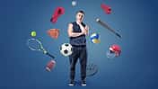 A,Thoughtful,Muscular,Man,Stands,Surrounded,By,Different,Sport,Gear