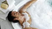 Man,Laying,In,Bubble,Bath