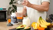 Sporty,Muscular,Man,Pouring,Protein,Powder,Into,Bottle,For,Shake