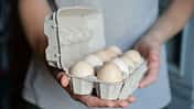 Caucasian,Man,With,Gray,T-shirt,Holding,A,Cardboard,Egg,Box