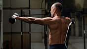 Backward,View,Of,A,Muscular,Shirtless,Mature,Older,Bodybuilding,Athlete