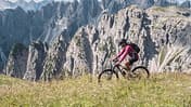 Mountain biking in Dolomites mountains.