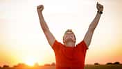 Successful,Man,Raising,Arms,After,Cross,Track,Running,On,Summer
