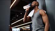 Side,View,Portrait,Of,Muscular,Black,Man,Drinking,Water,After