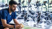 Sports,Man,Eating,Banana,During,Training,In,Gym.