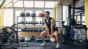 Man training with kettlebell