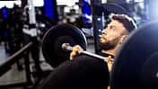 Weightlifting session in a modern gym focusing on strength training and fitness